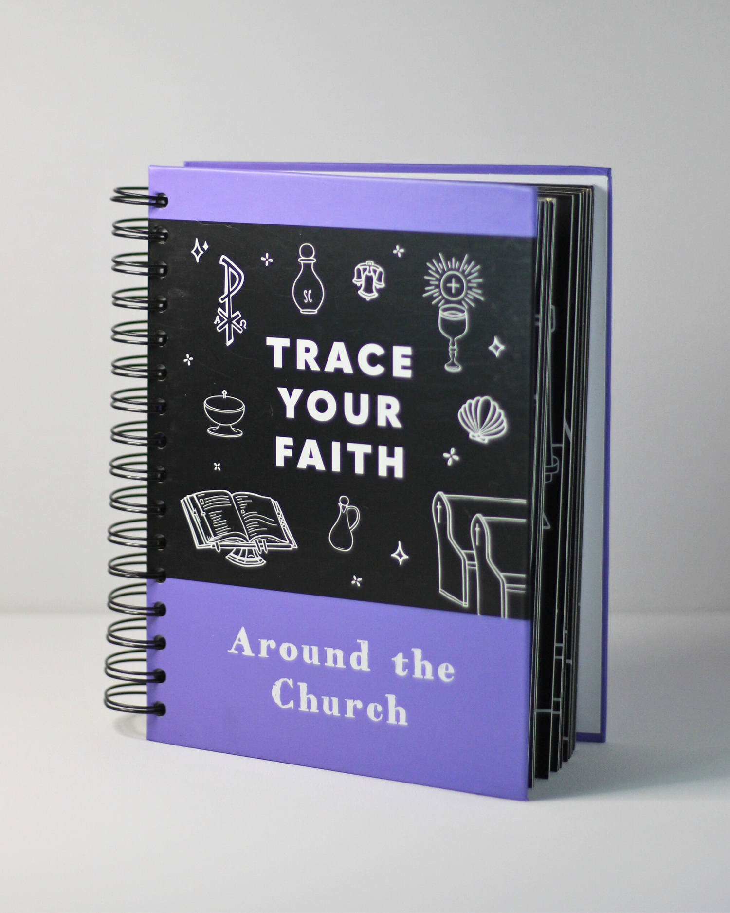 Notebook with 'Trace Your Faith Around the Church' text and illustrations on a gray background
